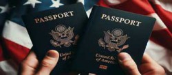 Hands Holding USA Passports with USA Flag in Background