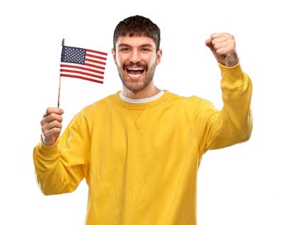 Young Smiling Ethnic Man Holding USA Flag and Clenched Fist
